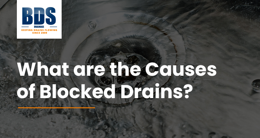 What causes blocked drains?