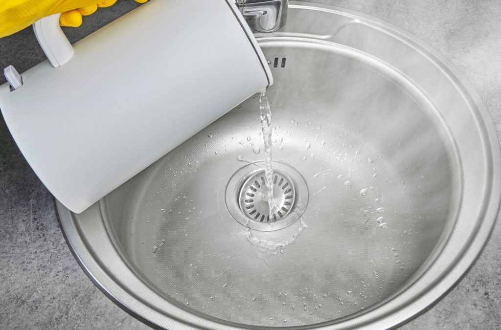 hot boiling water into sink