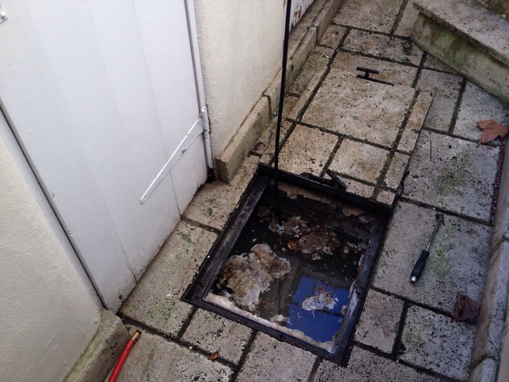 uncovered drain blocked and overflowing in Kent
